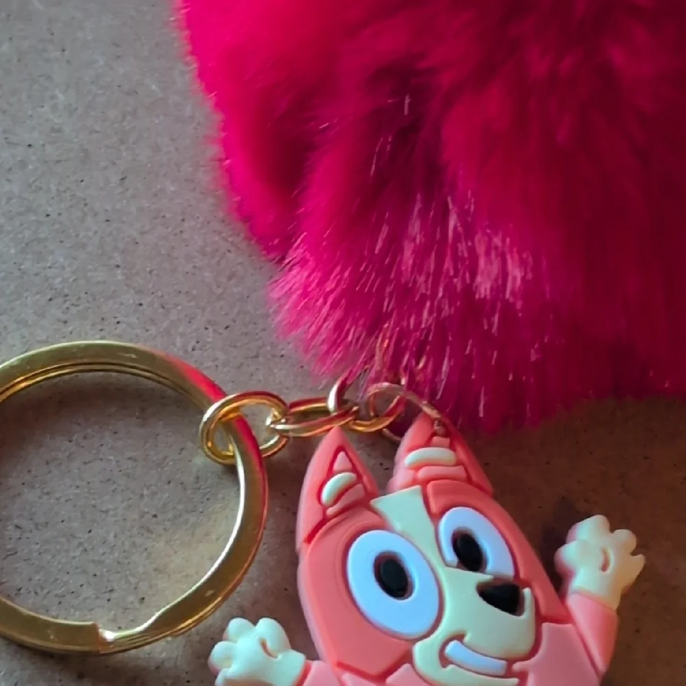 Vibrant Red Fluffy Keychain with Cartoon Charm